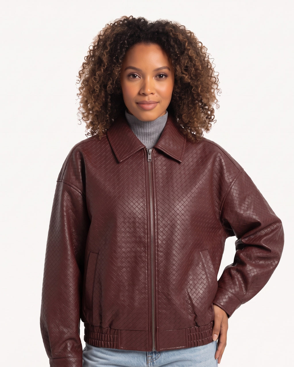 Burgundy faux leather bomber jacket with collared zip front and elastic hem