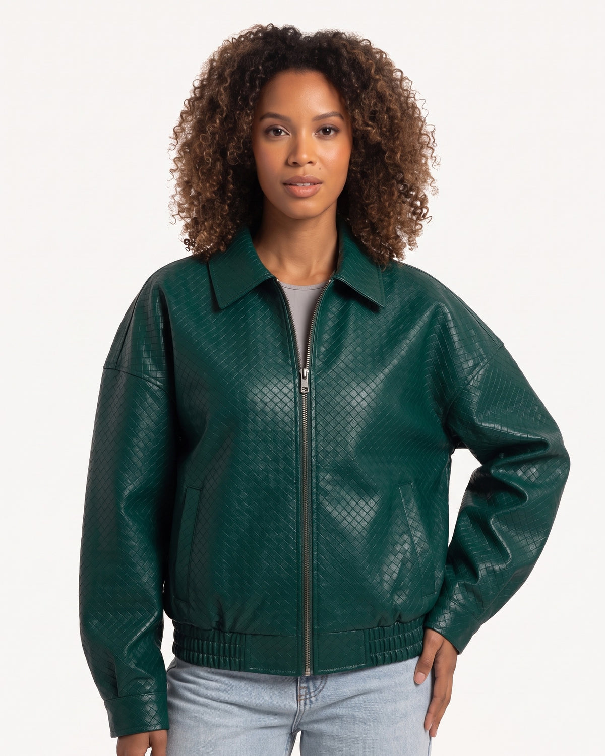 Dark green faux leather bomber jacket with collared zip front and elastic hem