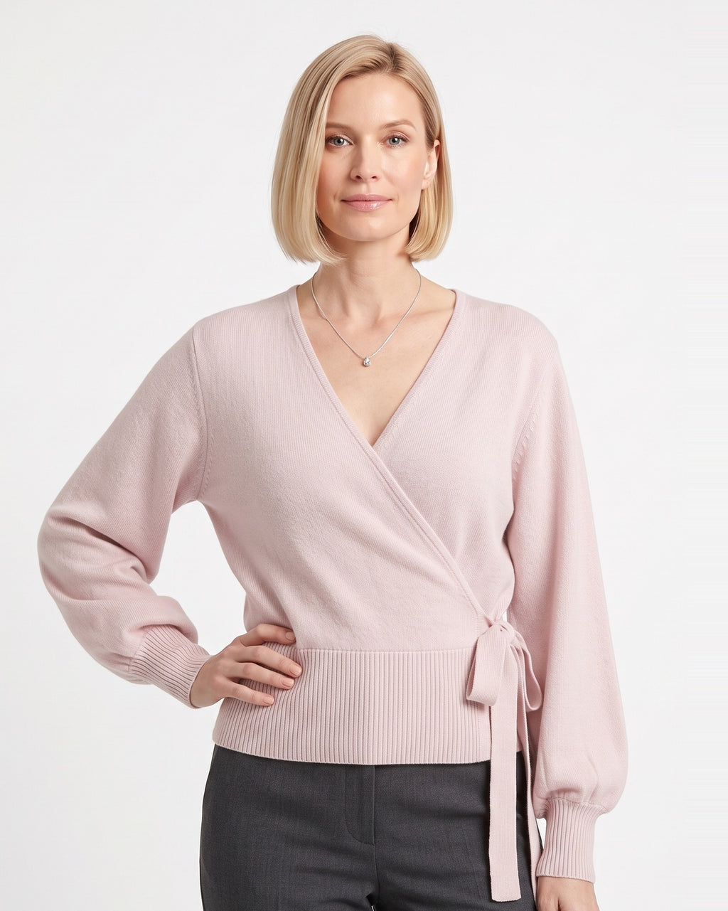 Blush pink cropped wrap knit sweater with V-neck and side tie waist long sleeves