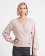 Blush pink cropped wrap knit sweater with V-neck and side tie waist long sleeves