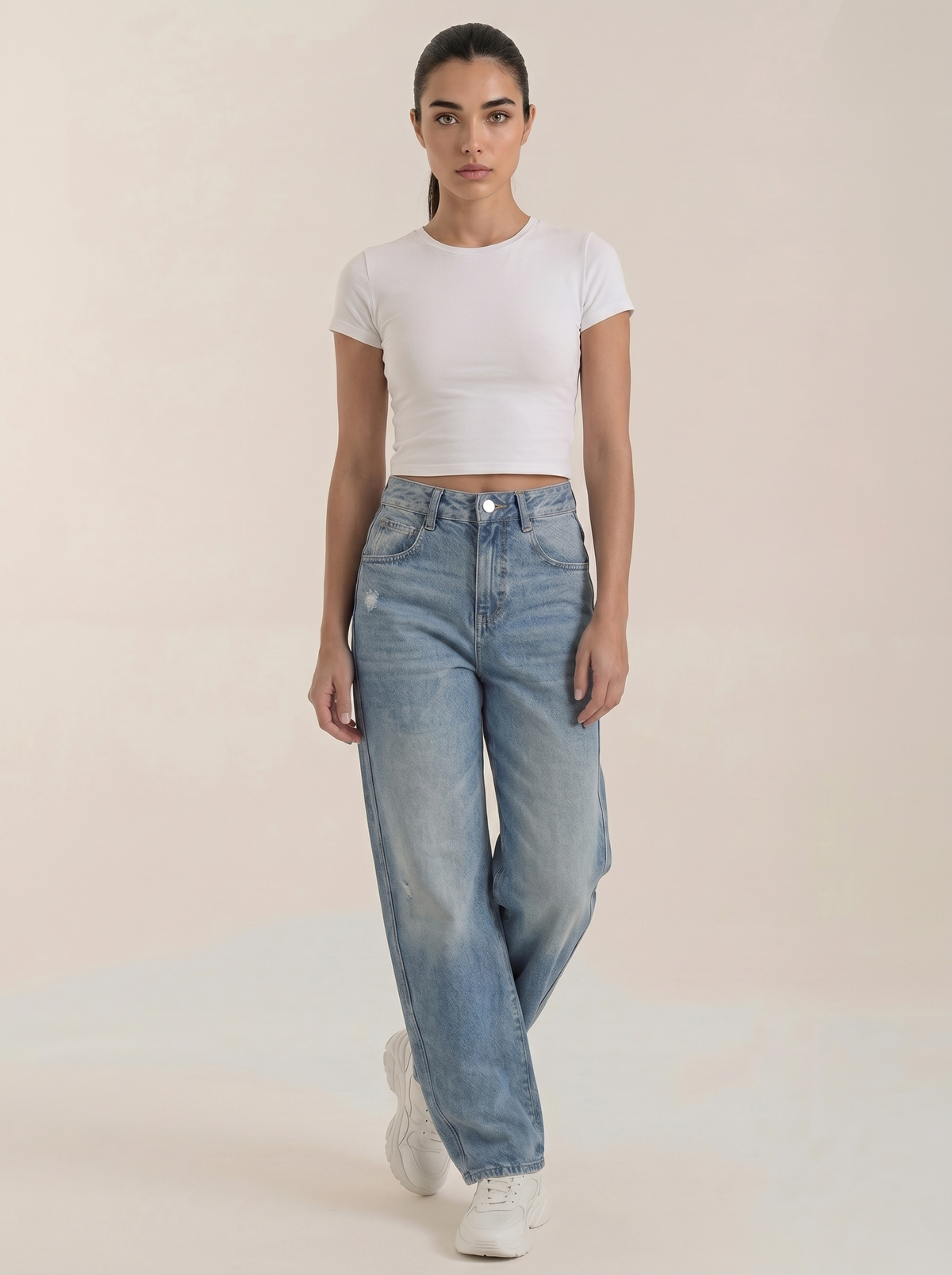 Medium wash wide-leg women's jeans with high-rise waistband and front button closure