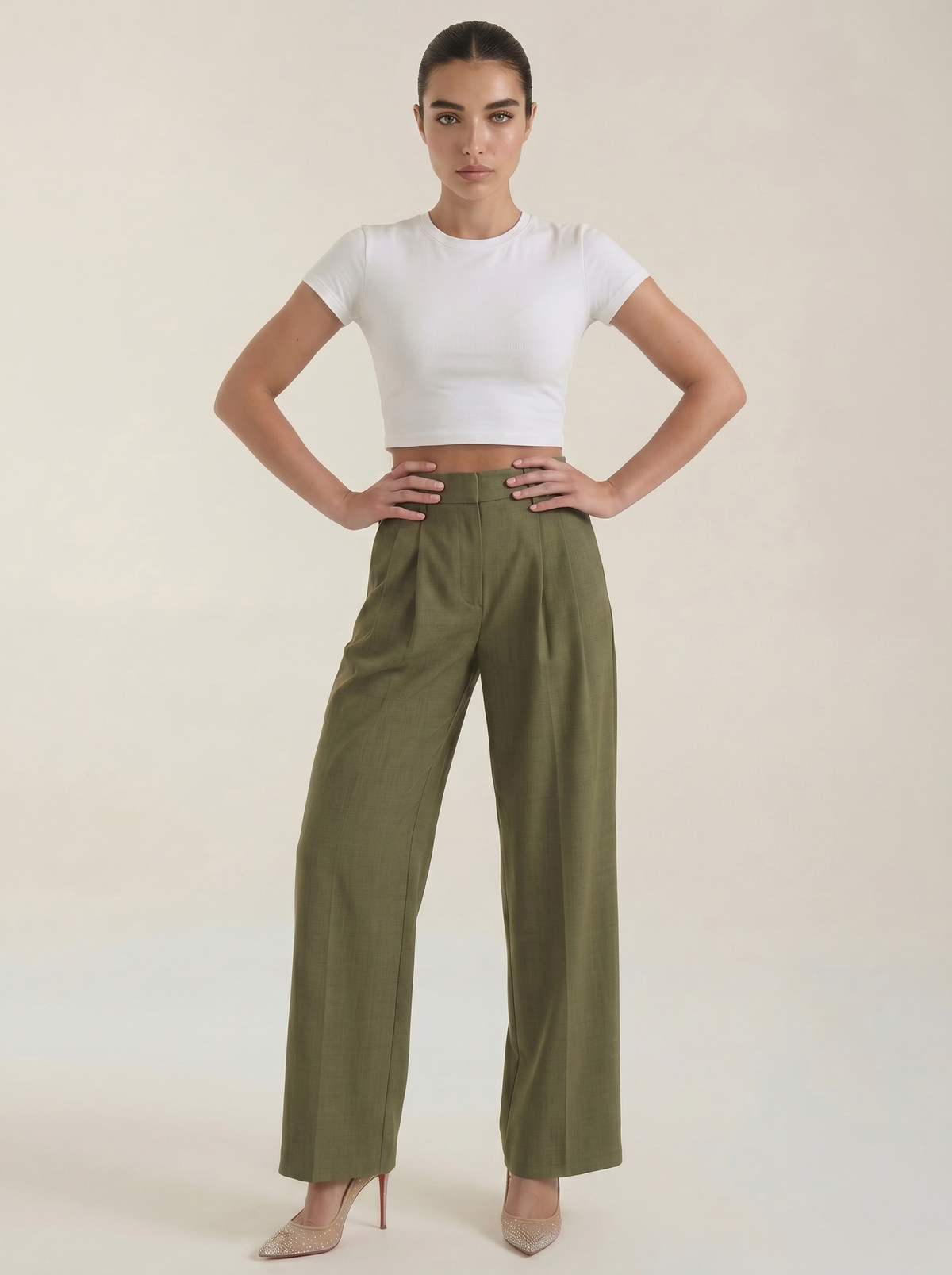 Dark green pleated high-rise wide-leg pants with front pleats and tapered straight legs