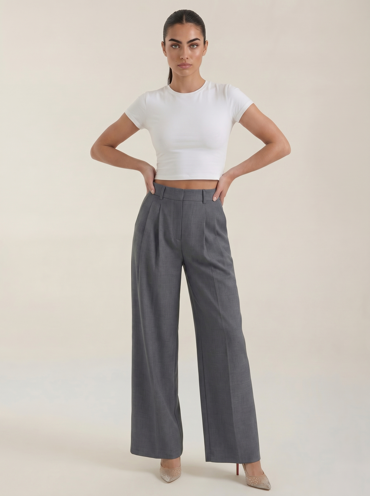 Gray pleated high-rise wide-leg pants with front creases and side pockets